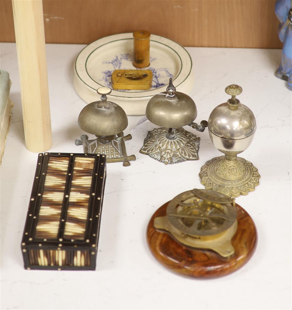 Three table bells, a porcupine quill box, a table compass and a Royal Doulton babys plate